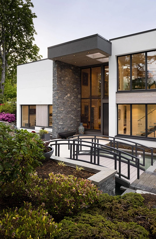 custom built home with bridge